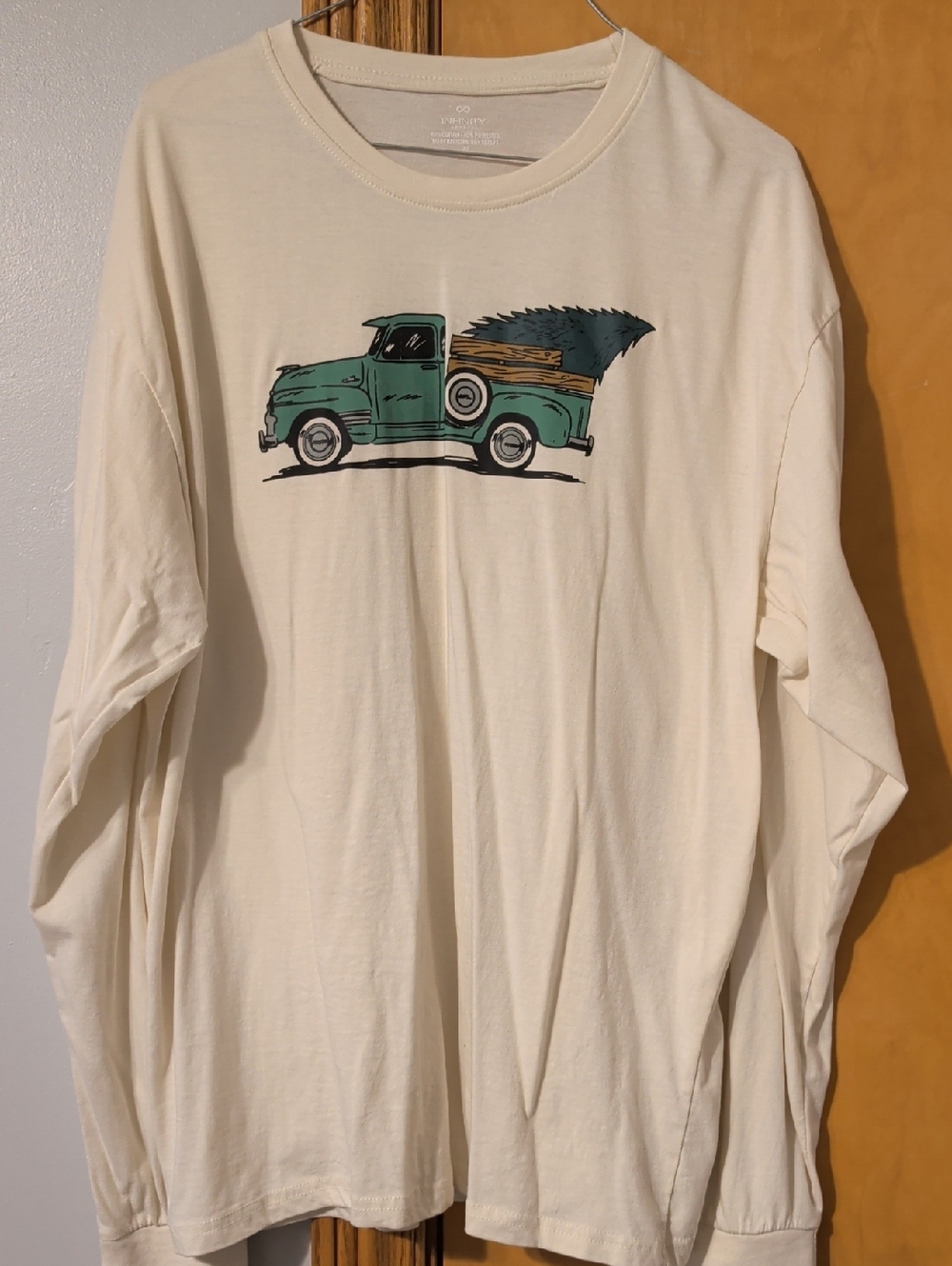 NFINITY Cream Long Sleeve Tee with Teal Pickup Graphic